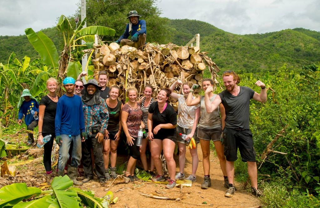 Volunteer helping in a community project while traveling abroad