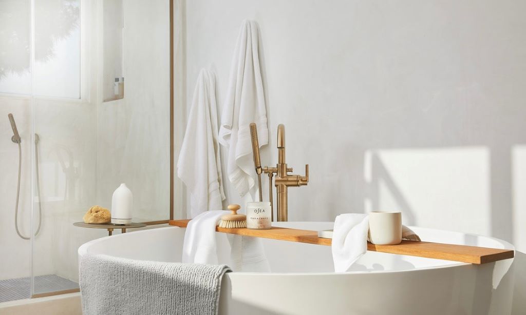 Colorful everyday bath towels displayed on a bathroom shelf for selection
